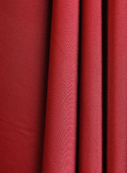 Red swimwear fabric draped in folds